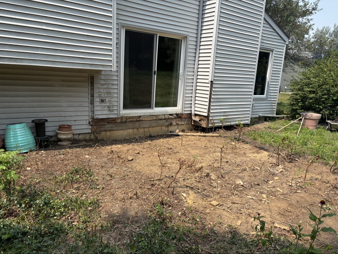 Deck gone, clean dirt after demolition